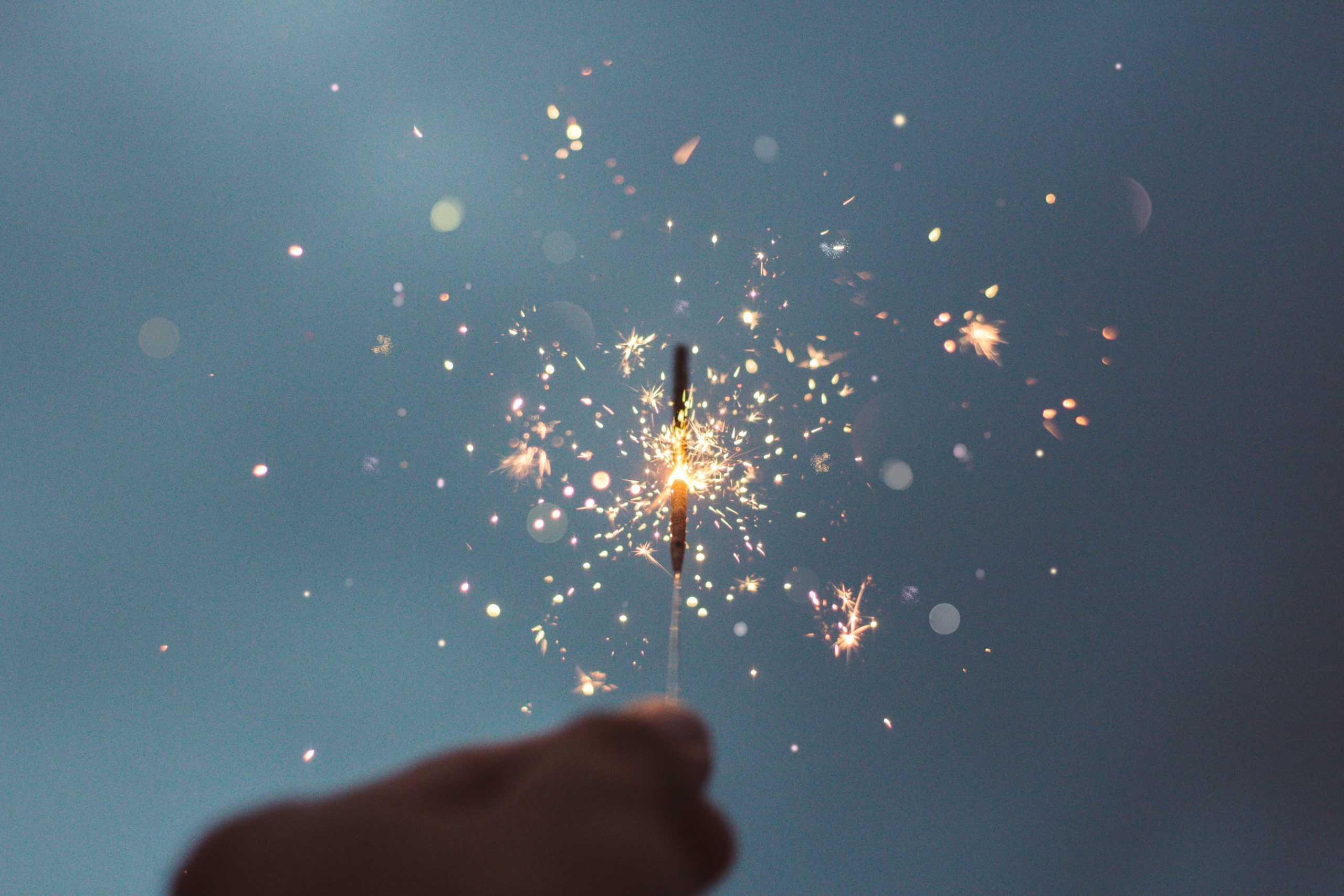 Non Diet Goals celebrating non-diet goals for the new year by lighting a sparkler